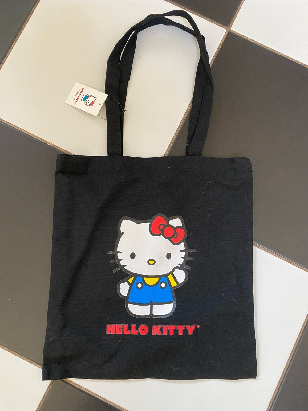 Hello Kitty Black Tote Bag with Red, White, Blue and Yellow Graphic